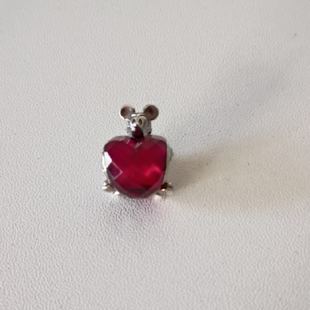 Pandora Disney Mickey Mouse Heart charm featuring a fuchsia crystal.